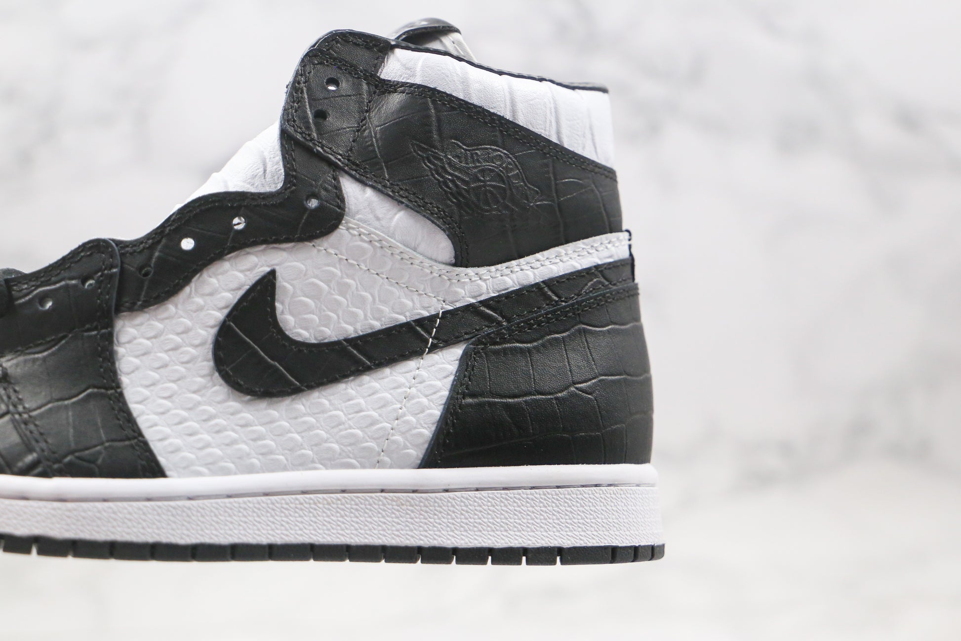 Air Jordan 1 High Snake Swoosh Logo